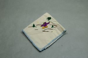 Image of Figure netting. One of a set of 4 embroidered napkins, each with figure at play